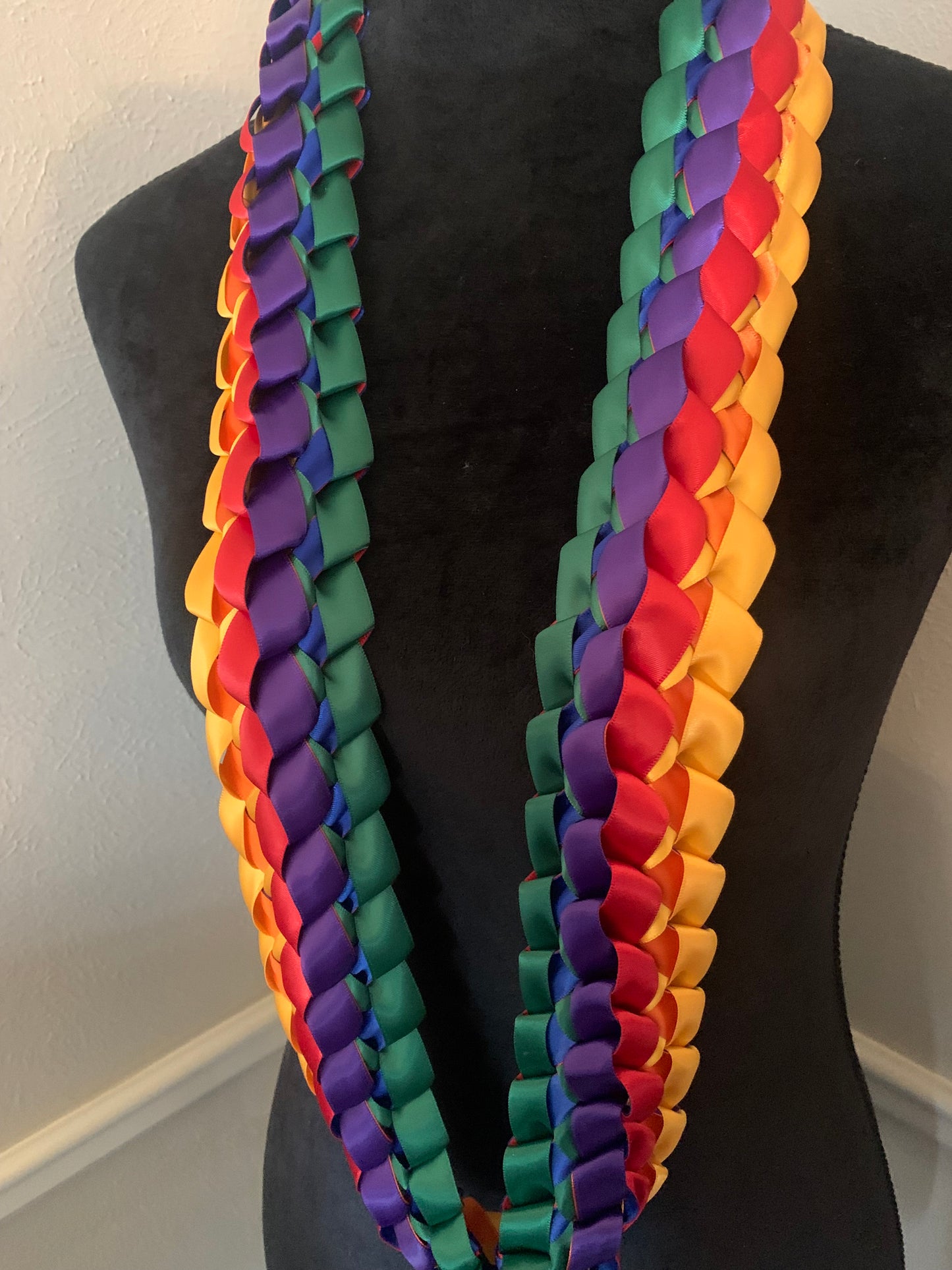 This Graduation Lei can be worn as a Lei or a Cord (open at bottom with two bows) Message for personalization ideas.