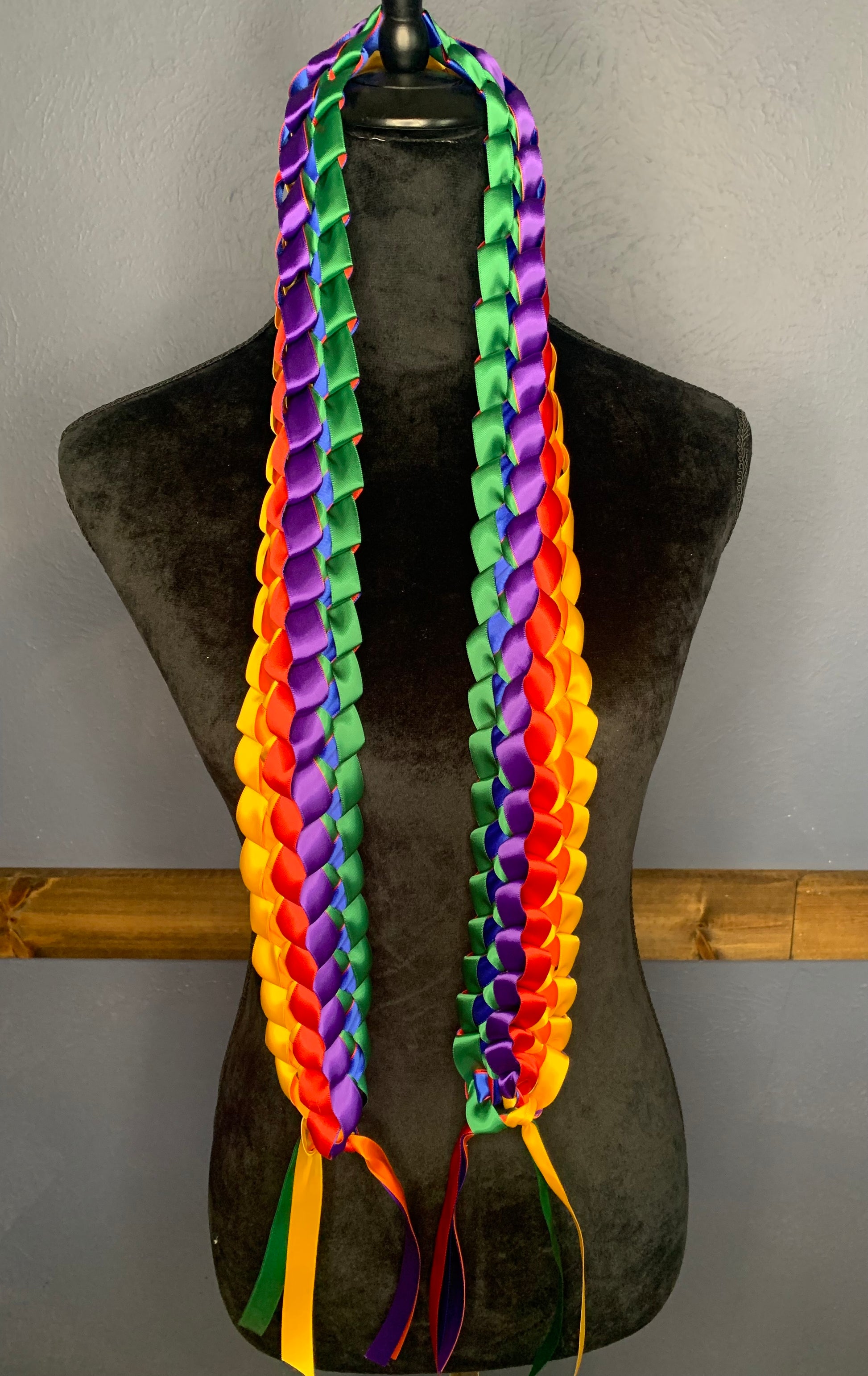 This Graduation Lei is being worn as  "cord", open at the bottom.  This cord can be personalized the same as Graduation Lei