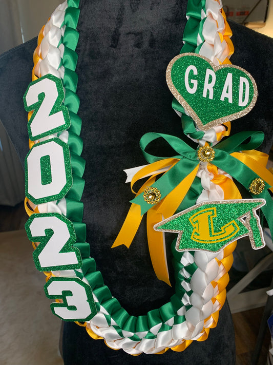 All Graduation Leis come with the graduate year, a bow and a name (or another embellishment such as grad hat, heart, etc.)